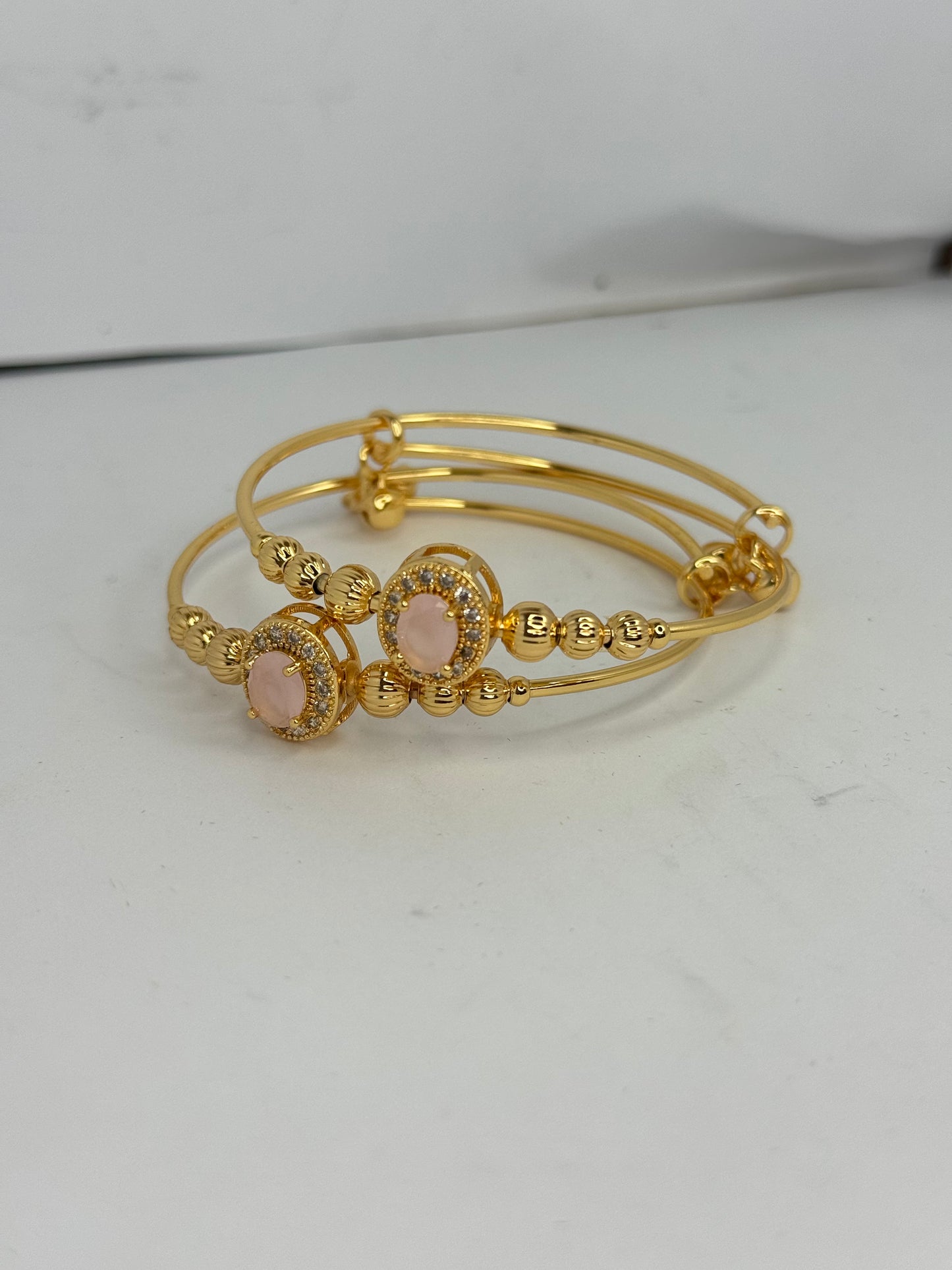 Gold Plated Pink Stone Bangles – Elegant Oval Design (Set of 2) - Glimzie