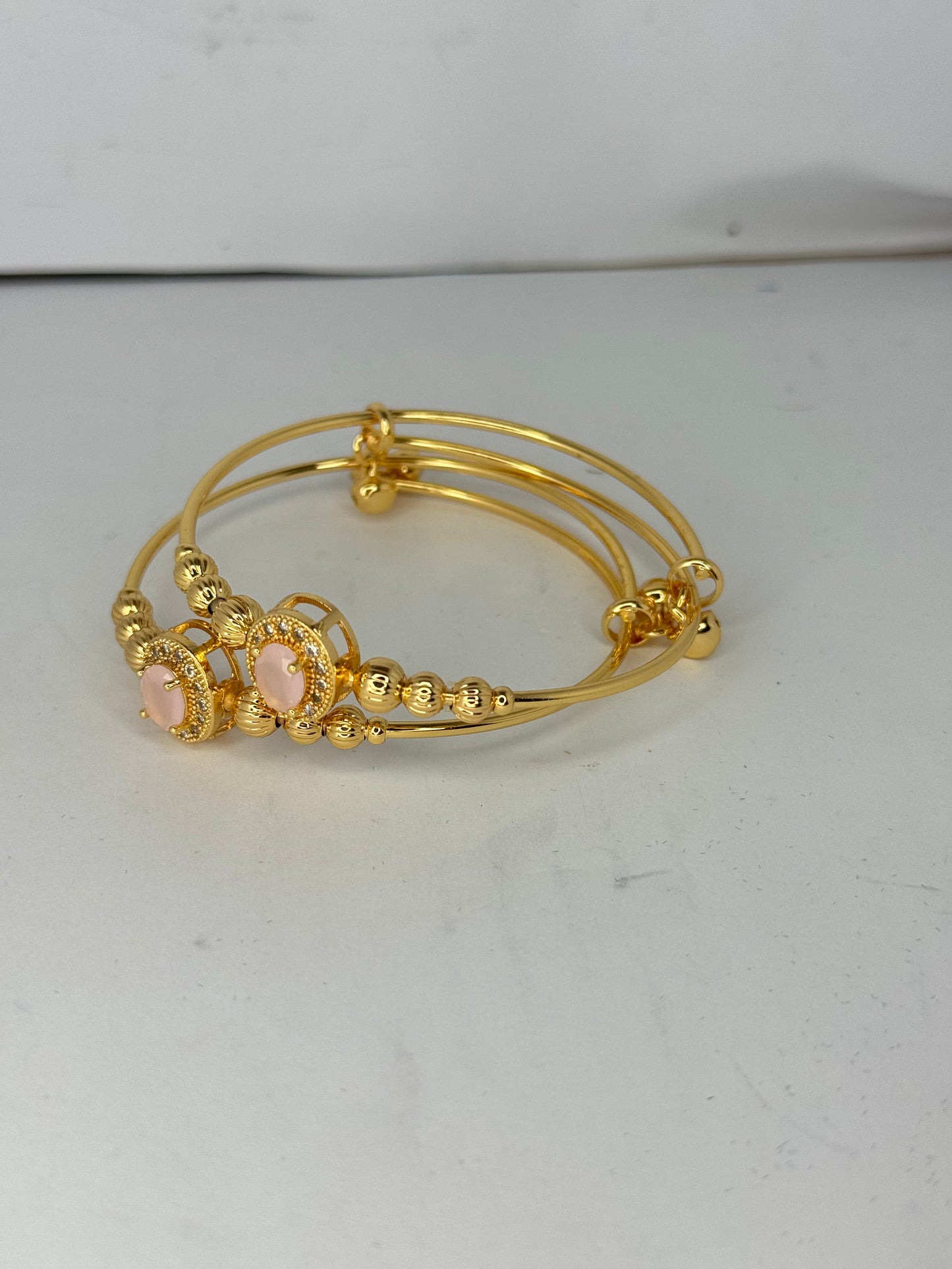 Gold Plated Pink Stone Bangles – Elegant Oval Design (Set of 2) - Glimzie