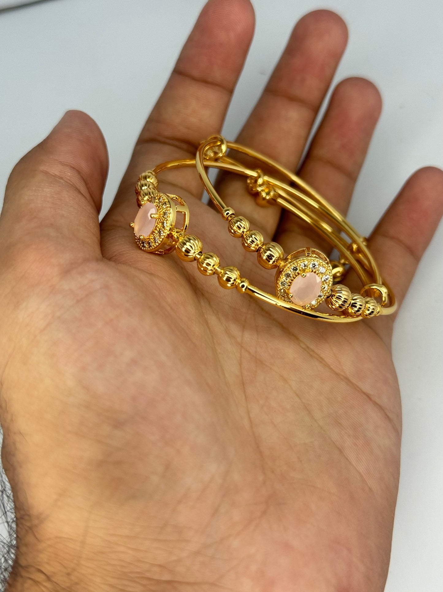 Gold Plated Pink Stone Bangles – Elegant Oval Design (Set of 2) - Glimzie