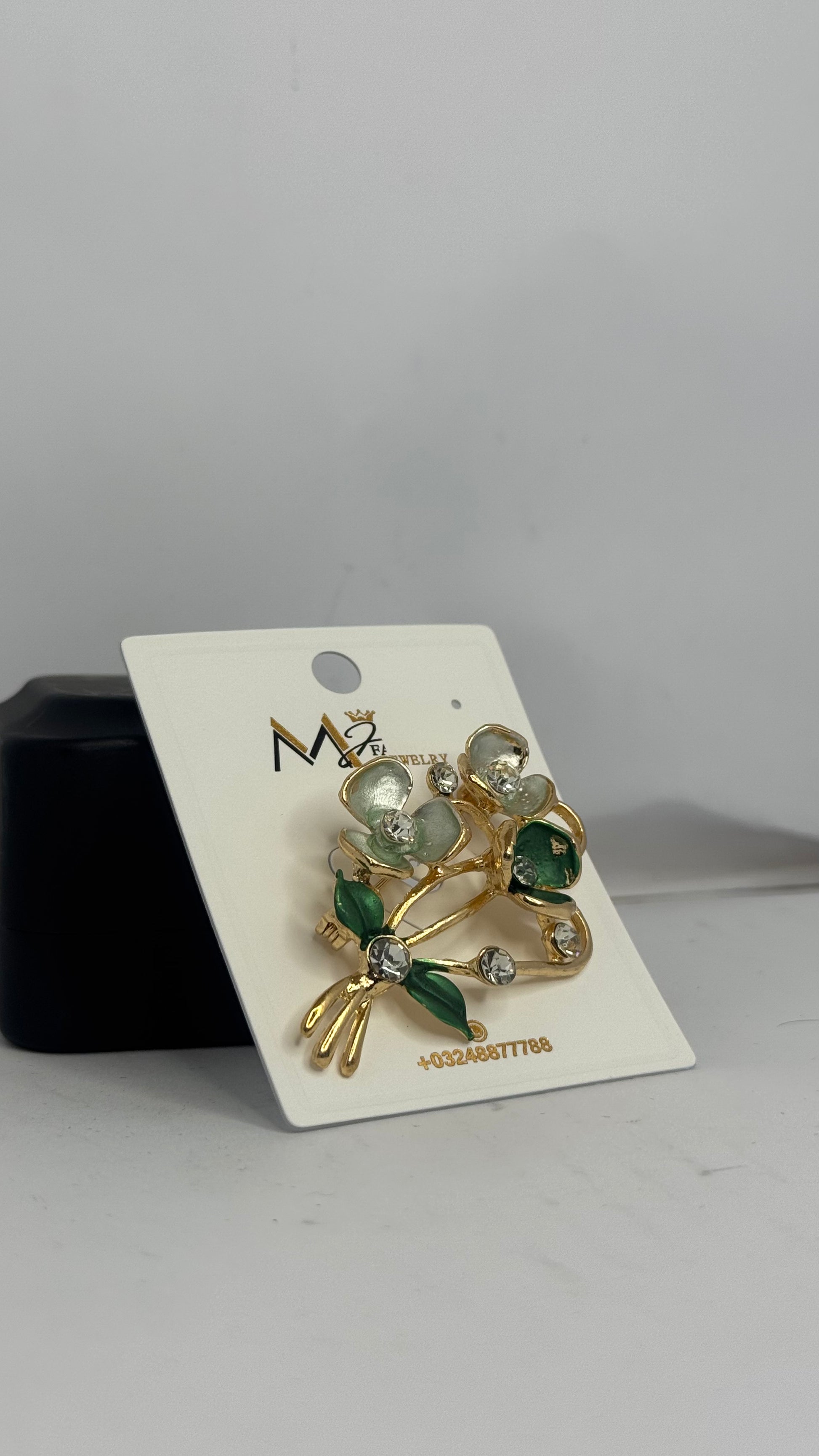 Elegant Floral Brooch with Green and White Stones - Glimzie