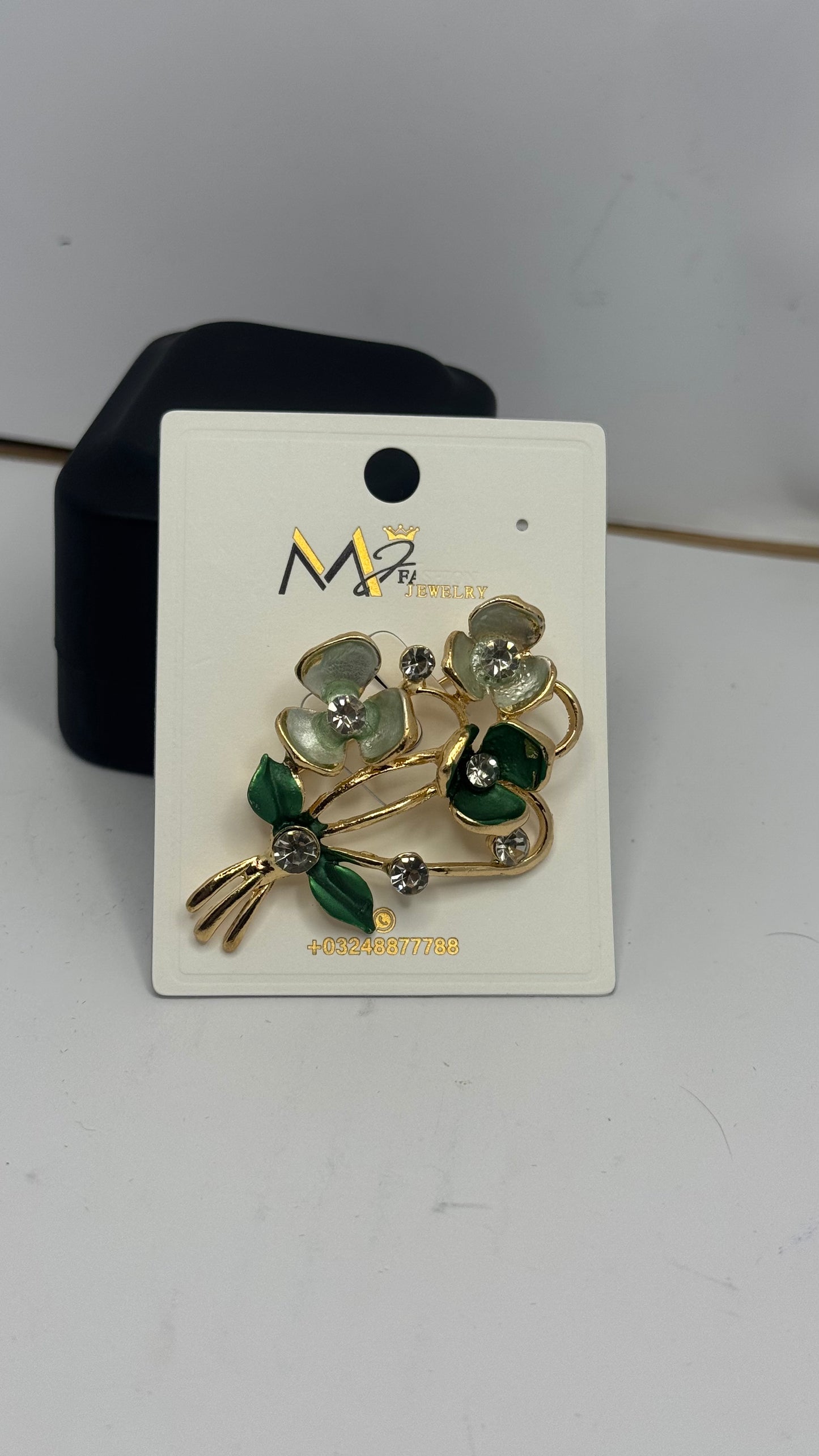 Elegant Floral Brooch with Green and White Stones - Glimzie