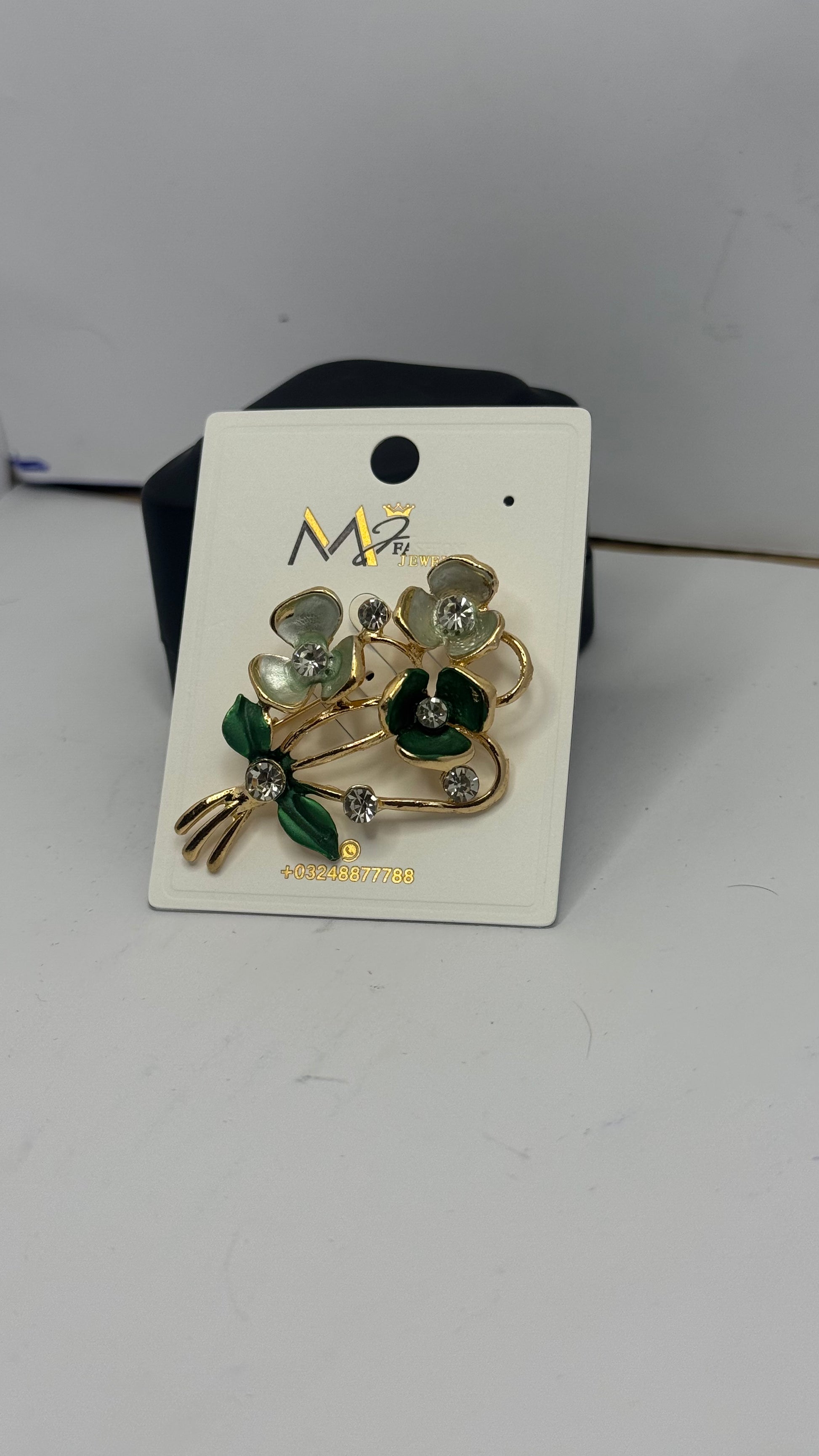 Elegant Floral Brooch with Green and White Stones - Glimzie