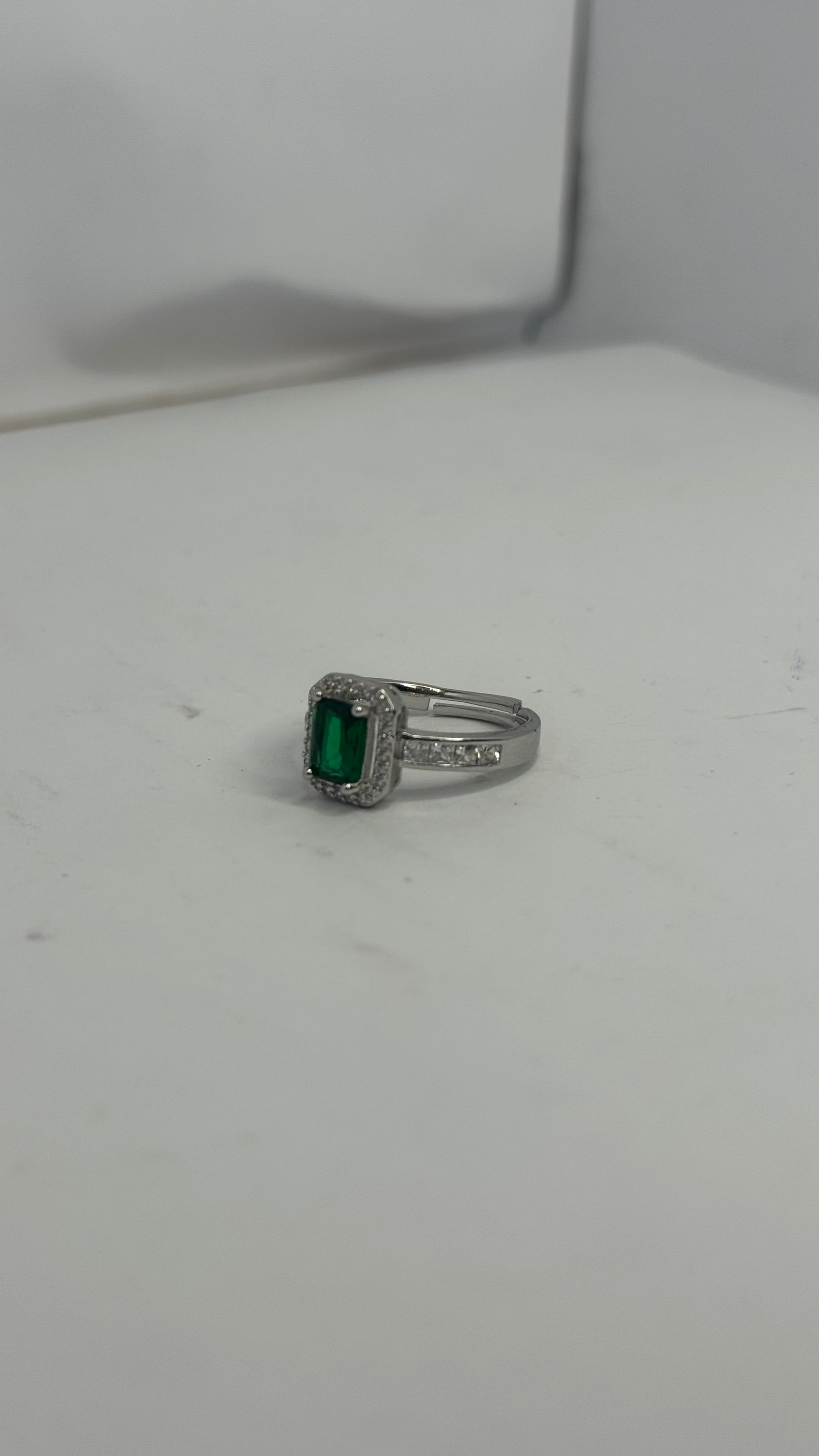Elegant Silver-Plated Ring with Emerald Green Center Stone – Classic Halo Design - Glimzie