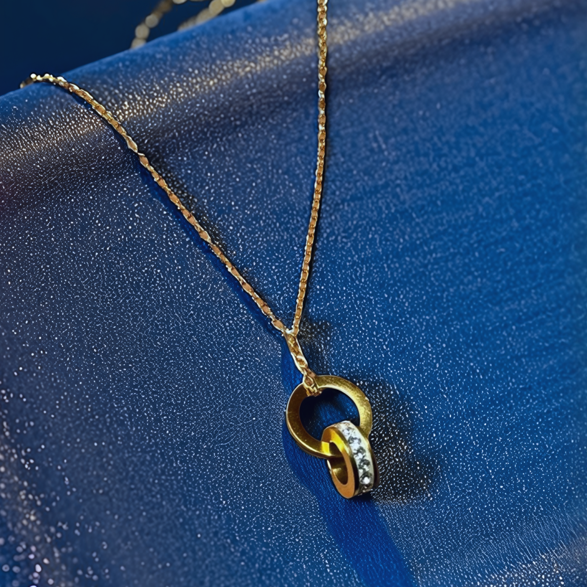 Elegant Interlocking Gold-Tone Pendant Necklace with Crystal Detailing - Glimzie